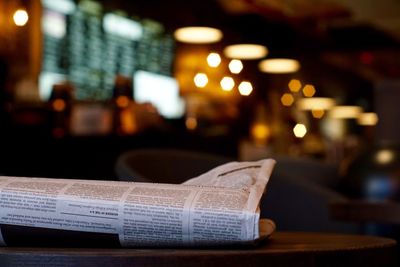 Close-up of newspaper on table