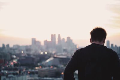 Woman looking at cityscape