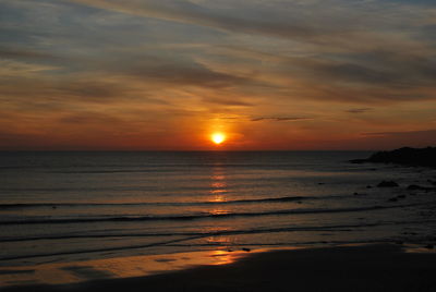 Scenic view of sea at sunset