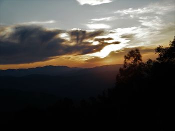 Scenic view of silhouette mountains against sky during sunset