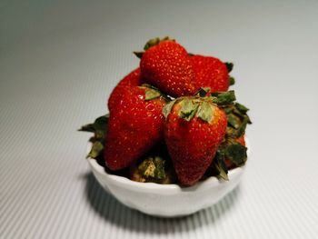 High angle view of strawberries in plate on table