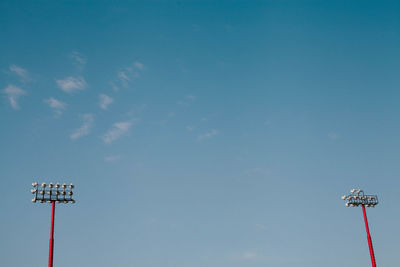 Low angle view of floodlight against sky