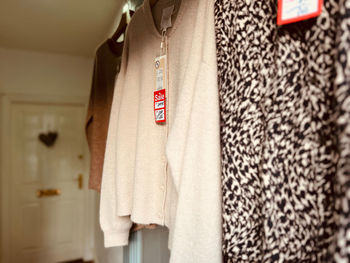 Close-up of clothes hanging in store