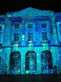 Low angle view of illuminated building at night