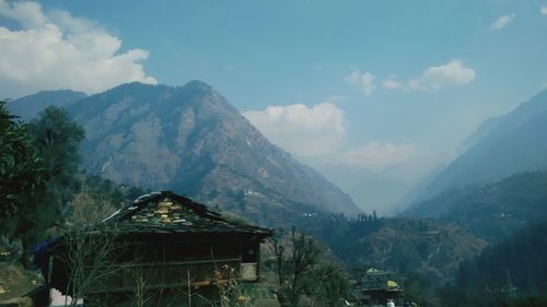 Panoramic view of building and mountains against sky