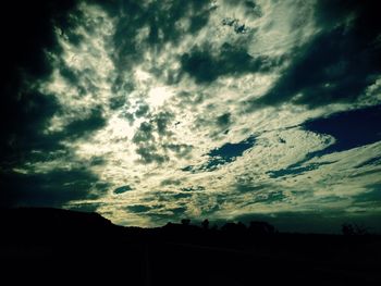 Low angle view of cloudy sky at sunset
