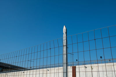 Low angle view of building against clear blue sky