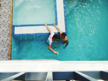 High angle view of man swimming in pool