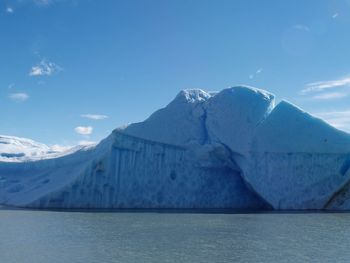 Scenic view of frozen sea against mountain range