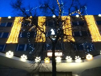 Buildings in city at night