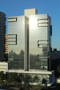 Low angle view of modern buildings against clear sky