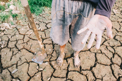 High angle view of man working in mud