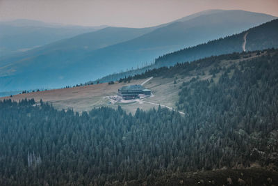 Panoramic view of land and mountains against sky