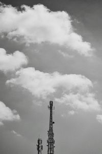 Low angle view of communications tower against sky