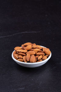 Close-up of sweet food on table against black background