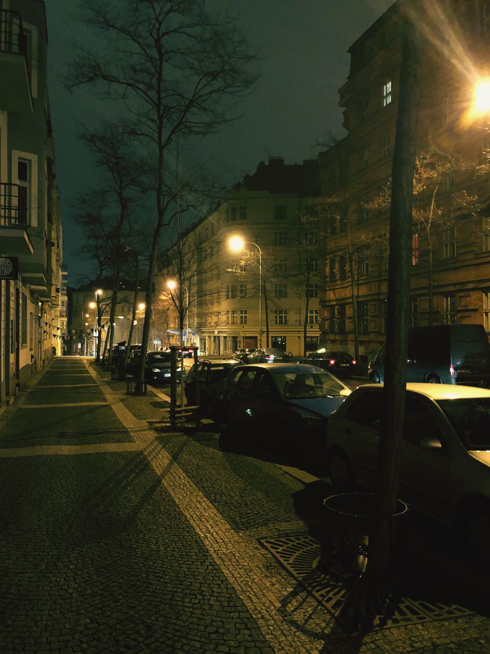 ILLUMINATED CITY STREET AT NIGHT