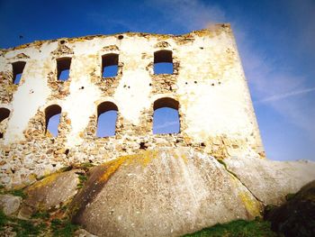 Low angle view of old ruin against clear sky