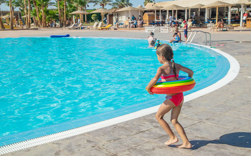 Full length of woman in swimming pool