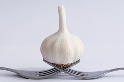 Close-up of white object over white background