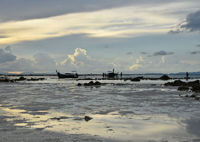 Scenic view of sea against cloudy sky