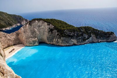 Scenic view of sea against blue sky