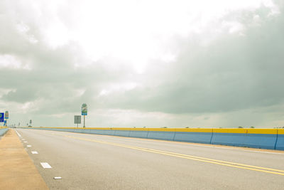 View of road against cloudy sky