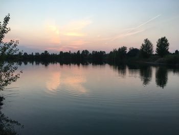 Scenic view of lake against sky during sunset