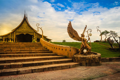 View of temple against cloudy sky