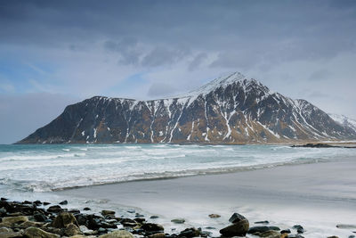 Scenic view of sea against sky during winter