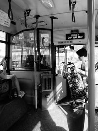 Rear view of man sitting in bus