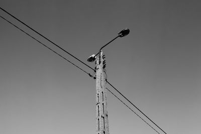 Low angle view of street light against clear sky