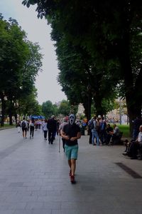 People walking on street in city