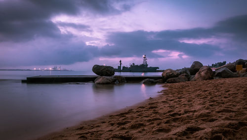 Panoramic view of beach against sky during sunset