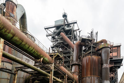 Low angle view of abandoned industry at landschaftspark