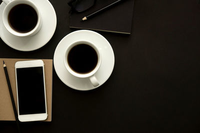 High angle view of black coffee on table