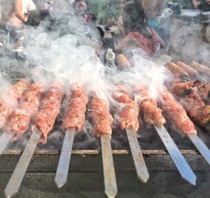 High angle view of meat on barbecue grill