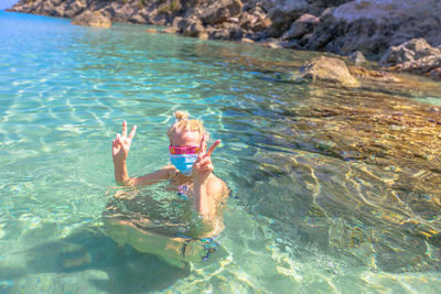 Woman swimming in sea