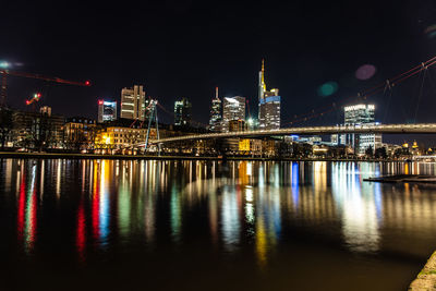 Illuminated city buildings at night