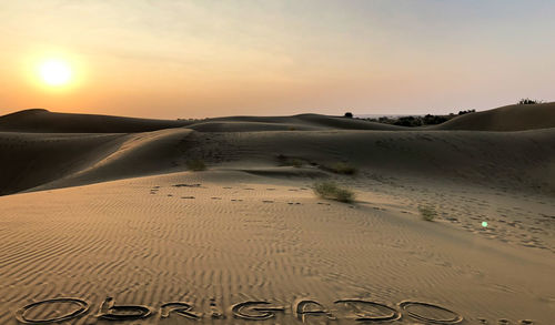 Scenic view of beach against sky during sunset