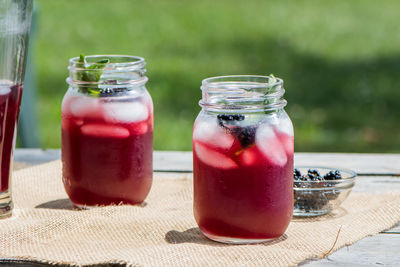 Close-up of drink in glass jar on table