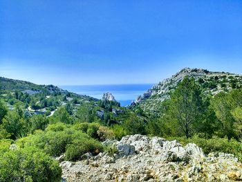 Scenic view of sea against clear blue sky