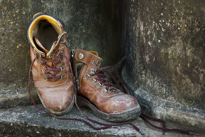 Close-up of shoes on rocks