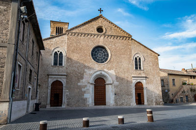 Facade of historic building against sky