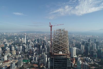 Aerial view of modern buildings against sky in city