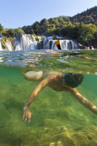 Man swimming in sea