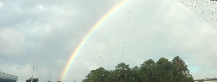 Low angle view of rainbow against sky