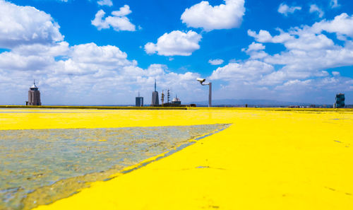 Scenic view of yellow field against sky