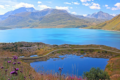 Scenic view of lake and mountains against sky