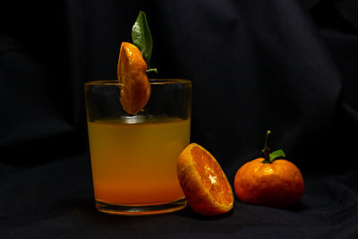 Close-up of orange juice on table