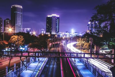 High angle view of light trails on road at night